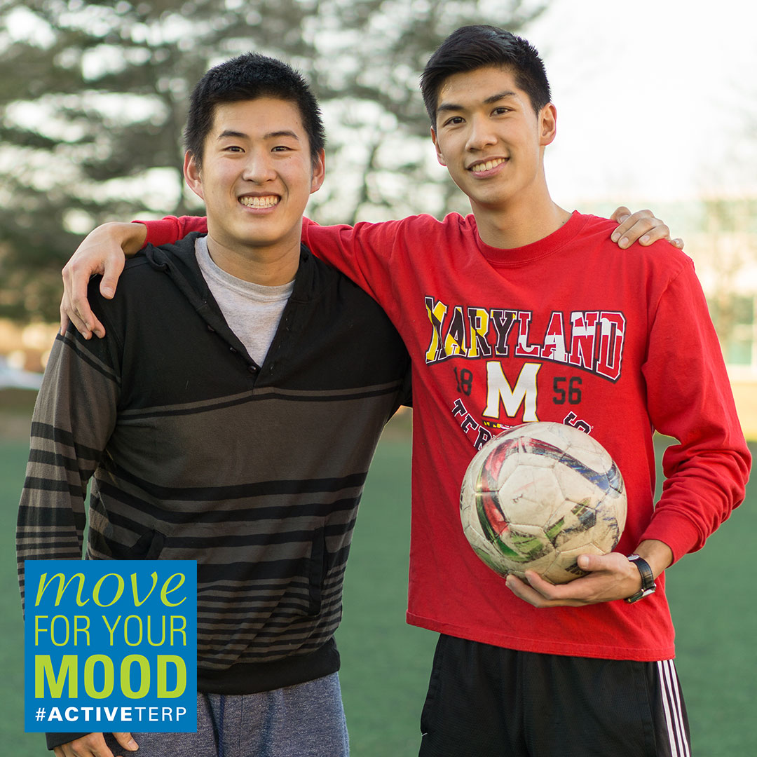 2 young men with a soccer ball